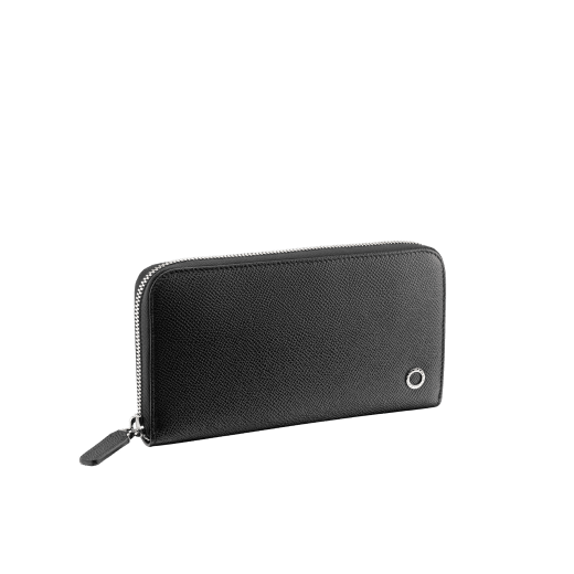 Zipped wallet in black grain calf leather with royal blue nappa lining. Brass palladium plated hardware featuring the Bvlgari-Bvlgari motif. Eight credit card slots, two internal gussets, one zipped coin case in the middle and two additional compartments. Zip-around closure. BBM-WLT-M-ZIPa image 1
