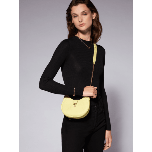 Serpenti Ellipse small crossbody bag in Urban grain and smooth flamingo quartz pink calf leather with flamingo quartz pink grosgrain lining. Captivating snakehead closure in gold-plated brass embellished with black onyx scales and red enamel eyes. Exclusive online color. 1204-UCLa image 6