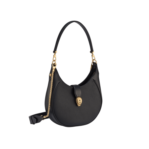 Serpenti Ellipse medium shoulder bag in Urban grain and smooth Niagara sapphire blue calf leather with cloud topaz blue grosgrain lining. Captivating snakehead closure in gold-plated brass embellished with black onyx scales and red enamel eyes. 1190-UCL image 4