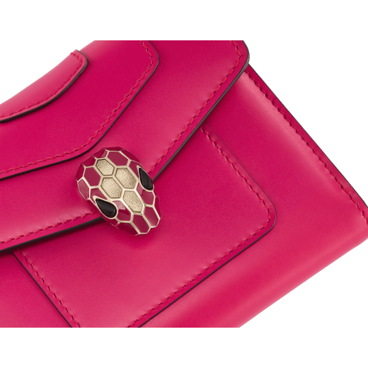 Serpenti Forever compact wallet in emerald green calf leather with violet amethyst nappa leather interior. Captivating snakehead press button closure in light gold-plated brass embellished with black and white agate enamel scales and green malachite eyes. SEA-WLT3FOLDCOMPb image 4