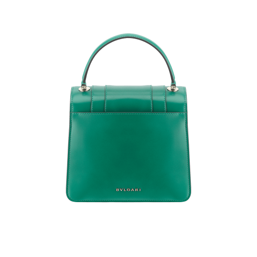 “Serpenti Forever ” top-handle bag in Lavender Amethyst lilac calf leather with Reef Coral red grosgrain inner lining. Iconic snakehead closure in light gold-plated brass embellished with black and white agate enamel and green malachite eyes. 1122-CLa image 3