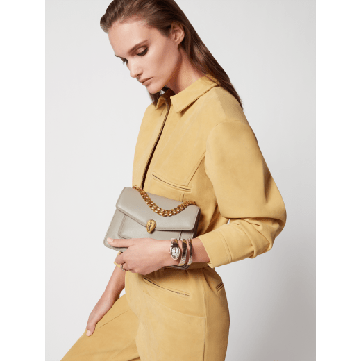 Serpenti Forever Maxi Chain small crossbody bag in foggy opal gray Metropolitan calf leather with linen agate beige nappa leather lining. Captivating snakehead magnetic closure in gold-plated brass embellished with gray agate scales and red enamel eyes. 1134-MCMC image 7