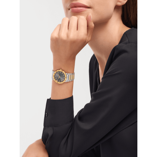 Bvlgari Bvlgari watch in 18 kt yellow gold and stainless steel, double logo engraving on the bezel, anthracite sunray dial and 12 diamond indexes. Water-resistant up to 30 metres 104196 image 1