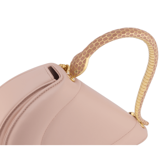 Serpenti Cuore 1968 top handle bag in star rose pink calf leather with crystal rose nappa leather lining. Captivating snake body-shaped top handle in gold-plated brass embellished with star rose pink enamel scales and zirconia eyes; press-button closure. SRN-001-1326S image 5