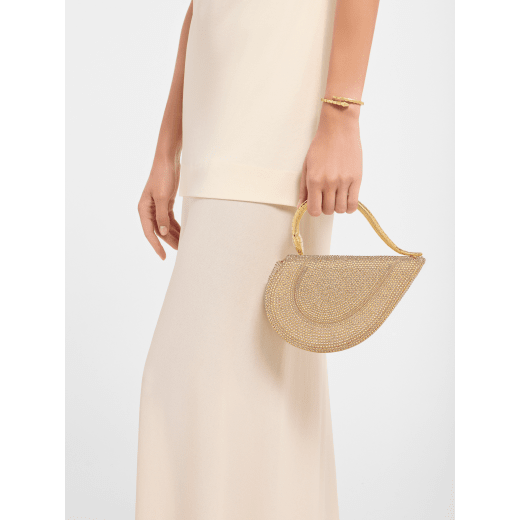 Serpenti Cuore 1968 top handle bag with gold Neige Pavé Crystals applied on a suede base and bright travertino nappa internal lining. Captivating snake body-shaped top handle in gold-plated brass embellished with engraved scales and zirconia eyes; press-button closure. SRN-001-1326S-CRYS image 1