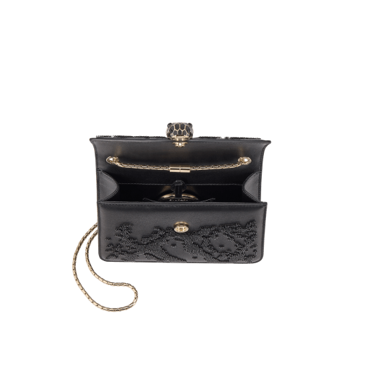 Serpenti Forever small crossbody bag in black Snake Invaders Metropolitan calf leather with a hand-sewn black glass beads embroidery and black nappa leather lining. Captivating snakehead magnetic closure in light gold-plated brass embellished with matte and shiny black enamel scales, and black onyx eyes. 292275 image 4
