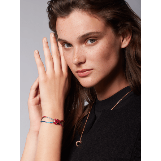 Serpenti Forever bracelet in shaded Niagara sapphire blue fabric. Palladium-plated brass captivating snakehead décor embellished with Niagara sapphire blue enamel scales and black enamel eyes. SERP-STRINGe image 2