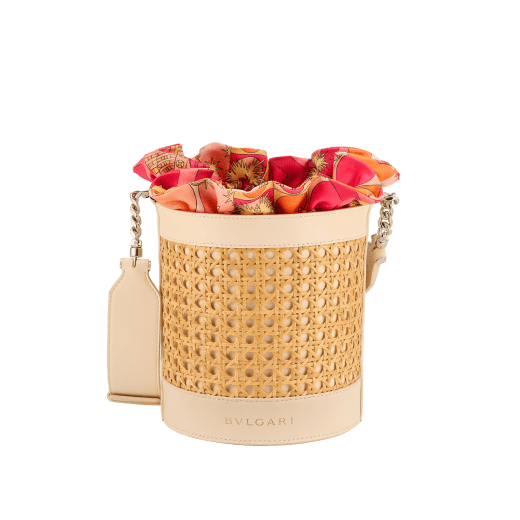 Serpenti Forever medium bucket bag in natural Vienna straw with ivory opal calf leather details. Detachable satin satchel with multicoloured print outside and beetroot spinel fuchsia inside, and drawstring closure with captivating snakeheads in light gold-plated brass. 292075 image 1