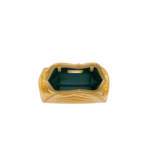 Serpentine small pouch in antique gold soft metallic crocodile skin with 24 kt gold treatment and emerald green nappa leather lining. Captivating snake-shaped frame in gold-plated brass including 3 µ of 24 kt gold, embellished with engraved scales and red enamel eyes on one side and antique gold soft metallic crocodile insert on the other, and press-button closure. Exclusive Bulgari 50th anniversary in the US Edition. 292591 image 4