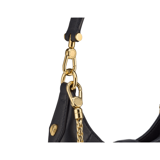 Serpenti Ellipse small crossbody bag in Urban grain and smooth ivory opal calf leather with flamingo quartz pink gros grain lining. Captivating snakehead closure in gold-plated brass embellished with black onyx scales and red enamel eyes. 1204-UCL image 5