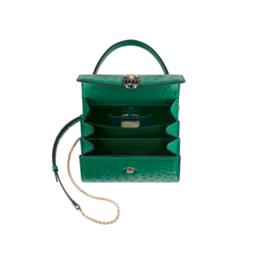 Serpenti Forever small top handle bag in vivid emerald green shiny ostrich skin with emerald green nappa leather lining. Captivating snakehead magnetic closure in light gold-plated brass embellished with black enamel and light gold-plated brass scales, and black onyx eyes. 293264 image 4