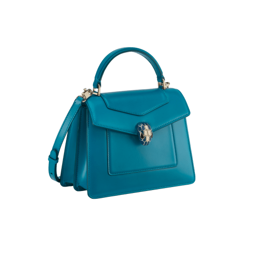 Serpenti Forever medium top handle bag in emerald green calf leather with black nappa leather lining. Captivating snakehead magnetic closure in light gold-plated brass embellished with deep jade intense green enamel and light gold-plated brass scales, and black onyx eyes. SEA-1282-CL image 2