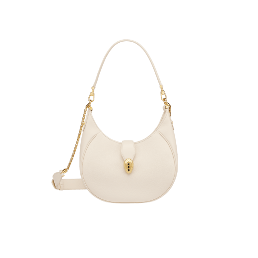 Serpenti Ellipse medium shoulder bag in Urban grain and smooth ivory opal calf leather with flamingo quartz pink grosgrain lining. Captivating snakehead closure in gold-plated brass embellished with black onyx scales and red enamel eyes. 1190-UCL image 1