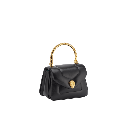 Serpenti Reverse micro top handle bag in truly tourmaline fuchsia Metropolitan calf leather with royal ruby red nappa leather lining. Captivating snakehead magnetic closure in gold-plated brass embellished with red enamel eyes. SRV-NANOREVERSE-MCL image 3
