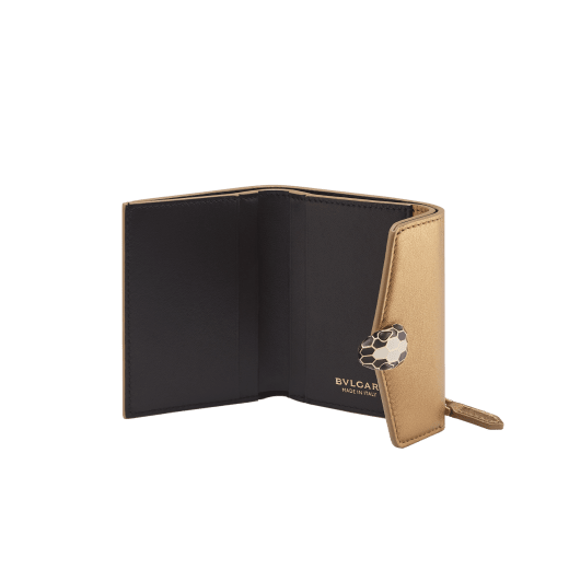 Serpenti Forever slim compact wallet in emerald green calf leather with black nappa leather interior. Captivating snakehead press button closure in light gold-plated brass embellished with black and white agate enamel scales and black onyx eyes. SEA-SLIMCOMPACT-Clb image 2
