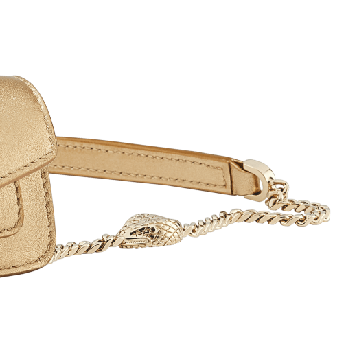 Serpenti Forever micro bag in gold calf leather. Captivating snakehead closure in light gold-plated brass embellished with red enamel eyes. SEA-NANOCROSSBODY image 3