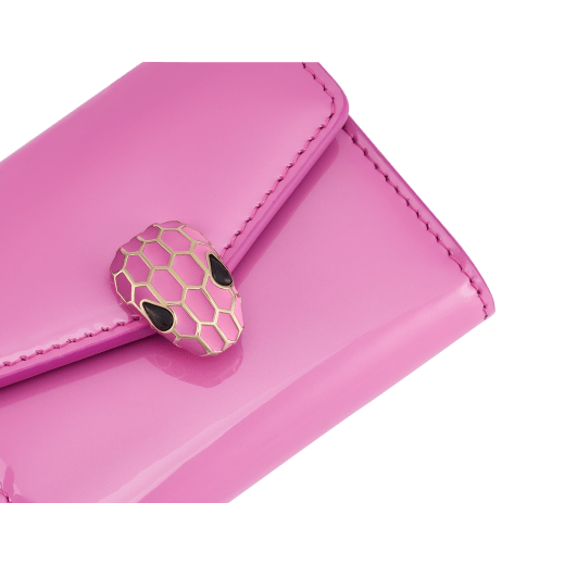 Serpenti Forever slim compact wallet in azalea quartz pink coated calf leather with black calf leather interior. Captivating snakehead press stud closure in rose gold-plated brass embellished with matt azalea quartz pink enamel scales and black onyx eyes. SEA-SLIMCOMPACT-VCLa image 4