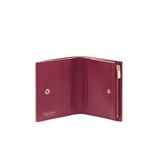 Bulgari Logo compact wallet in primrose quartz pink calf leather with hot-stamped Infinitum pattern all over and anemone spinel pinkish-red nappa leather interior. Light gold-plated brass hardware and press-stud closure. BVL-COMPACTWLTa image 2