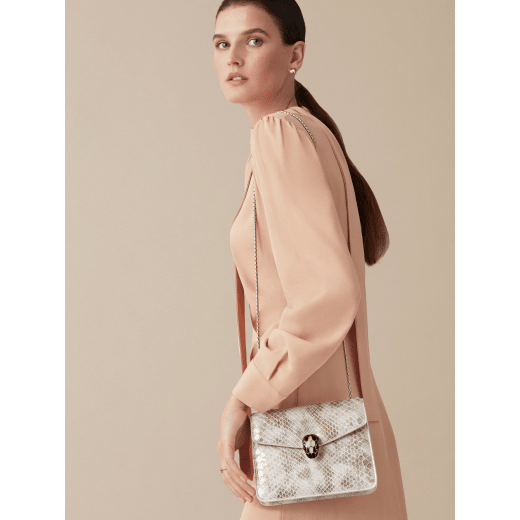 “Serpenti Forever” crossbody bag in roccia "Mineral" python skin. Iconic snakehead closure in light gold plated brass enriched with black and hawk's eye enamel, and black onyx eyes. 422-Pd image 2