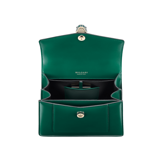 Serpenti Forever medium top handle bag in emerald green calf leather with black nappa leather lining. Captivating snakehead magnetic closure in light gold-plated brass embellished with deep jade intense green enamel and light gold-plated brass scales, and black onyx eyes. SEA-1282-CL image 4