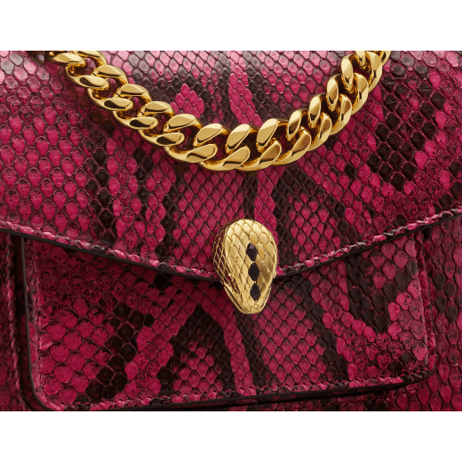 Serpenti Forever Maxi Chain small crossbody bag in anemone spinel pinkish red soft shiny python skin with black nappa leather lining. Captivating magnetic snakehead closure in gold-plated brass embellished with black onyx scales and red enamel eyes. 1134-SSP image 5