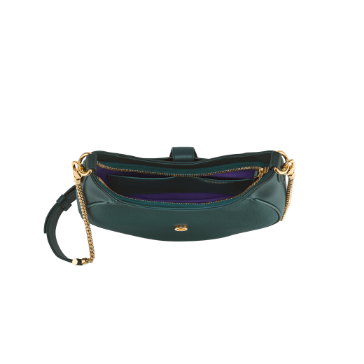 Serpenti Ellipse medium shoulder bag in Urban grain and smooth ivory opal calf leather with flamingo quartz pink grosgrain lining. Captivating snakehead closure in gold-plated brass embellished with black onyx scales and red enamel eyes. 1190-UCL image 4