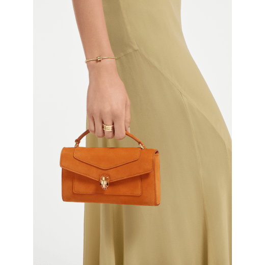 Serpenti Forever phone case in Terracotta nubuck leather. Captivating snakehead magnetic closure in gold-plated brass embellished with Terracotta enamel and gold-plated brass scales, and black onyx eyes. 295636 image 1