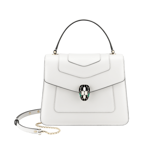 “Serpenti Forever” top handle bag in emerald green calf leather. Iconic snake head closure in light gold plated brass enhanced with black and white agate enamel and green malachite eyes. 1050-CL image 2