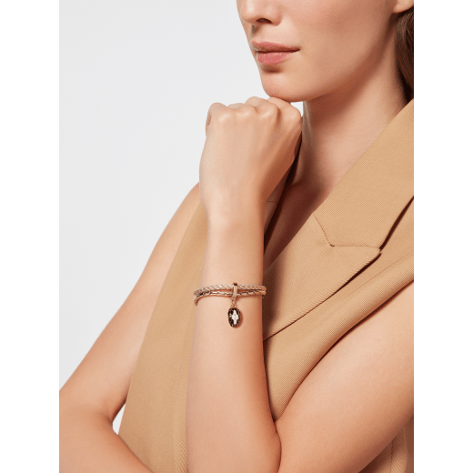 Serpenti Forever bracelet in gold and silver braided calf leather and light gold-plated brass chain with magnetic clasp closure. Captivating snakehead charm with black and white agate enamel scales and black enamel eyes. SERPBRAIDCHAIN-WCL-GS image 2