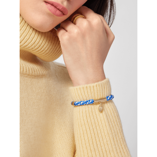 Serpenti Forever bracelet in Niagara sapphire blue, cobalt tourmaline blue and ivory opal woven fabric. Captivating snakehead charm in light gold-plated brass embellished with red enamel eyes, and press-button closure. SERPMULTISTRING-WF-SoB image 1