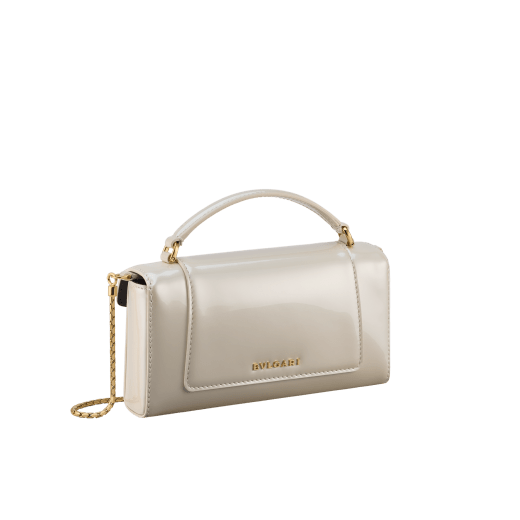 Serpenti Forever phone case in white agate varnished calf leather with black nappa leather lining. Captivating snakehead magnetic closure in gold-plated brass embellished with white agate enamel and gold-plated brass scales, and black onyx eyes. 295159 image 2