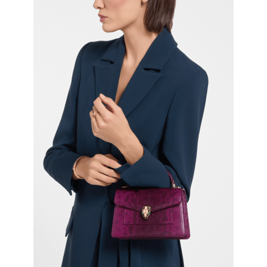 Serpenti Forever mini top handle bag in light amethyst pure karung with light amethyst nappa leather lining. Captivating snakehead magnetic closure in gold-plated brass embellished with light amethyst enamel and gold-plated brass scales, and black onyx eyes. SEA-001-1283XS-kar image 1