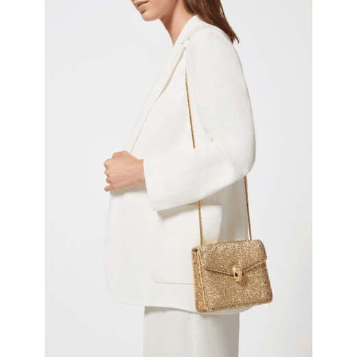 Serpenti Forever small crossbody bag in natural suede with different-size gold crystals and black nappa leather lining. Captivating magnetic snakehead closure in gold-plated brass embellished with "diamantatura" engraving on the scales, and black onyx eyes. 292889 image 8