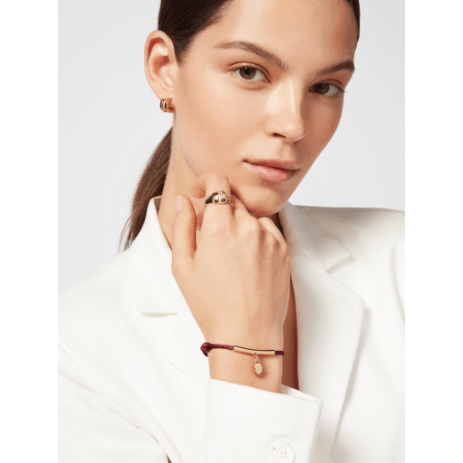 Serpenti Forever bracelet in Sahara amber light brown fabric. Gold-plated brass tubular element and captivating snakehead charm embellished with red enamel eyes. SERP-HERMINISTRING image 1