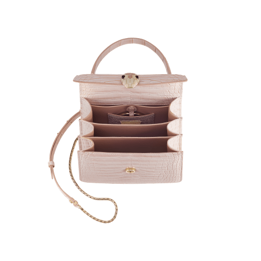 Serpenti Forever small top handle bag in white Moonpearl alligator skin with crystal rose nappa leather lining. Captivating snakehead magnetic closure in light gold-plated brass embellished with white agate enamel and pink quartz scales and black onyx eyes. 293468 image 4