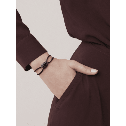 "Serpenti Forever" bracelet in Midnight Sapphire blue fabric with an alluring snakehead décor in light gold-plated brass enamelled in black and glittery Hawk's Eye grey, with seductive black enamel eyes. SERP-STRINGd image 1