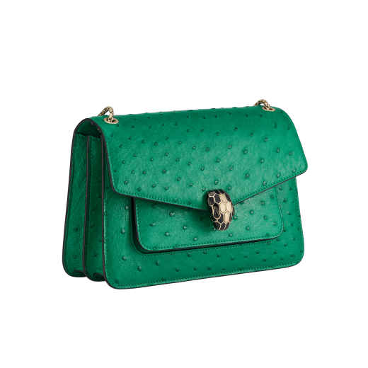 Serpenti Forever medium shoulder bag in vivid emerald green shiny ostrich skin with emerald green nappa leather lining. Captivating snakehead magnetic closure in light gold-plated brass embellished with black enamel and light gold-plated brass scales and black onyx eyes. 293263 image 2