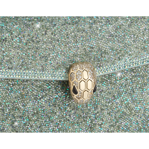 Serpenti Forever mini crossbody bag in natural suede with different-size gold crystals and black nappa leather lining. Captivating magnetic snakehead closure in gold-plated brass embellished with "diamantatura" engraving on the scales and black onyx eyes. 986-CDS image 5