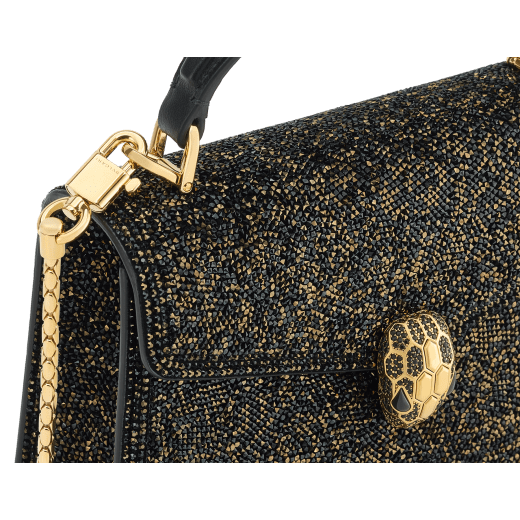 Serpenti Forever mini top handle bag in black Crystal Sparkle suede with black nappa leather lining. Captivating snakehead magnetic closure in gold-plated brass embellished with black zirconia pavé and gold-plated brass scales, and black onyx eyes. SEA-1283-CS image 5
