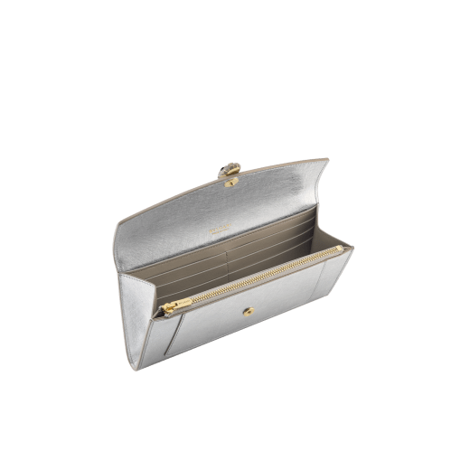 Serpenti Forever large wallet in black calf leather with emerald green nappa leather interior. Captivating snakehead magnetic closure in light gold-plated brass embellished with black enamel and light gold-plated brass scales, and black onyx eyes. SEA-LONG-WLT-R image 2