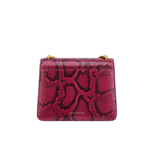 Serpenti Forever Maxi Chain small crossbody bag in soft, shiny anemone spinel pinkish red python skin with black nappa leather lining. Captivating magnetic snakehead closure in gold-plated brass embellished with black onyx scales and red enamel eyes. 1134-SSP image 3