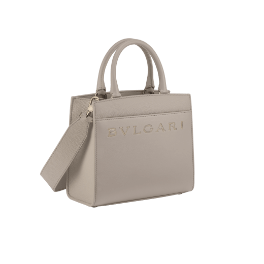 Bulgari Logo small tote bag in foggy opal grey smooth and grained calf leather with linen agate beige grosgrain lining. Iconic Bulgari logo decorative chain in light gold-plated brass, with hook fastening. BVL-1202SCLL image 2