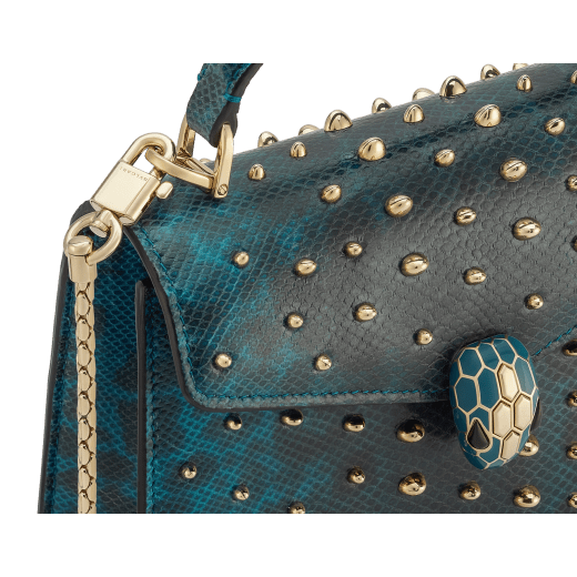 Serpenti Forever mini top handle bag in Laguna blue Cabochon shiny karung skin with metal studs and black nappa leather lining. Captivating snakehead magnetic closure in light gold-plated brass embellished with bright Laguna blue enamel and light gold-plated brass scales, and black onyx eyes. 293746 image 5