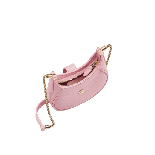 Serpenti Ellipse micro bag in soft, drummed, flash diamond white calf leather with taffy quartz pink grosgrain lining. Captivating snakehead closure in gold-plated brass embellished with mother-of-pearl scales and red enamel eyes, leather tab with magnet, and zippered fastening. SEA-MICROHOBOc image 2