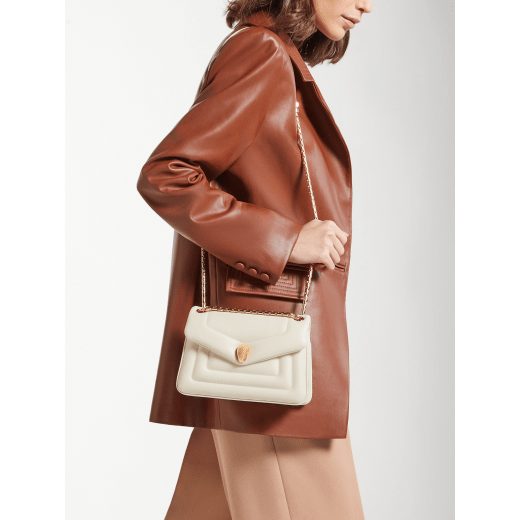 Serpenti Reverse small shoulder bag in ivory opal quilted Metropolitan calf leather with black nappa leather lining. Captivating snakehead magnetic closure in gold-plated brass embellished with red enamel eyes. 1244-MCL image 8
