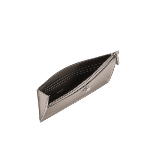 Serpenti Forever pouch in black calf leather with black nappa leather interior. Captivating snakehead rivet in dark ruthenium-plated brass embellished with red enamel eyes. SEA-UNIPOUCH-CL image 3