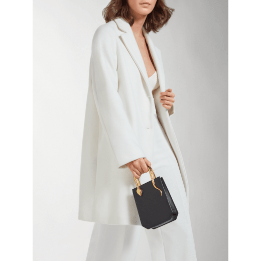 Serpentine mini tote bag in ivory opal Metropolitan calf leather with black nappa leather lining. Captivating snake body-shaped handles in gold-plated brass embellished with engraved scales and red enamel eyes. SRN-1223-CL image 9