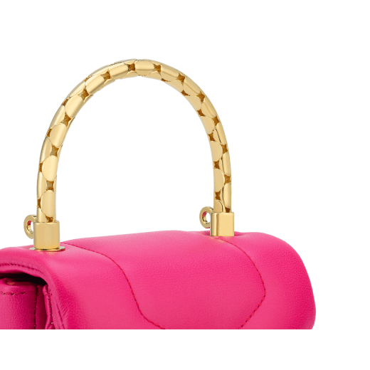 Serpenti Reverse micro top handle bag in truly tourmaline fuchsia Metropolitan calf leather with royal ruby red nappa leather lining. Captivating snakehead magnetic closure in gold-plated brass embellished with red enamel eyes. SRV-NANOREVERSE-MCL image 6