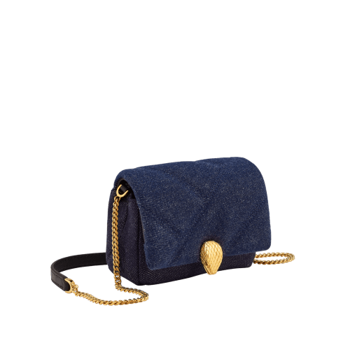 Serpenti Cabochon micro bag in ivory opal calf leather with a maxi matelassé pattern and black nappa leather lining. Captivating snakehead closure in gold-plated brass embellished with red enamel eyes. SCB-NANOCABOCHONa image 1