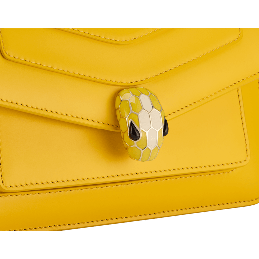 Serpenti Forever East-West small shoulder bag in sun citrine yellow calf leather with linen agate beige grosgrain lining. Captivating snakehead magnetic closure in light gold-plated brass embellished with sun citrine yellow and white agate enamel scales, and black onyx eyes. 1237-CL image 5